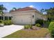 Attached two-car garage offers convenience and security for your vehicles and storage at 11435 Fort Lauderdale Pl, Venice, FL 34293