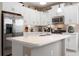 Kitchen featuring stainless steel appliances, granite counters, and ample white cabinets at 11435 Fort Lauderdale Pl, Venice, FL 34293