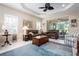 Spacious living room boasts natural light, ceiling fan, and access to outdoor space at 11435 Fort Lauderdale Pl, Venice, FL 34293