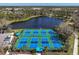 Active community featuring multiple pickleball courts and a scenic lake view at 11435 Fort Lauderdale Pl, Venice, FL 34293