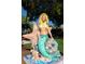 Mermaid statue on display with starfish accents, blending art and nature at 11435 Fort Lauderdale Pl, Venice, FL 34293