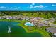 Aerial view of home and community with a large pool, clubhouse and beautiful pond at 12613 Oak Hill Way, Parrish, FL 34219