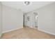 Light-filled bedroom features plush carpeting, neutral walls, and multiple doors at 12613 Oak Hill Way, Parrish, FL 34219