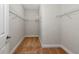 Walk-in closet with wire shelving and carpeted floor at 12613 Oak Hill Way, Parrish, FL 34219