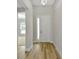 Entryway featuring wood flooring, neutral paint, modern chandelier, and view of living area at 12613 Oak Hill Way, Parrish, FL 34219