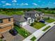 Charming home with a paved driveway, lush lawn, and a two-car garage, blending comfort and style at 12613 Oak Hill Way, Parrish, FL 34219