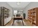 Home office features a modern desk, built-in shelving, and stylish decor at 12613 Oak Hill Way, Parrish, FL 34219