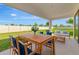 Outdoor seating area with a table and chairs on a patio at 12613 Oak Hill Way, Parrish, FL 34219