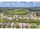 Beautiful aerial view of the community, highlighting well-maintained homes and serene lake at 12642 Cara Cara Loop, Bradenton, FL 34212