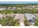 Beautiful aerial view of a well-maintained house with lush greenery and a serene neighborhood setting at 12642 Cara Cara Loop, Bradenton, FL 34212
