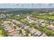 Scenic aerial view of the neighborhood featuring lush landscaping and peaceful ponds at 12642 Cara Cara Loop, Bradenton, FL 34212