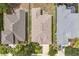 High-angle view of a home showcasing its roof, backyard, and landscaping within a peaceful neighborhood at 12642 Cara Cara Loop, Bradenton, FL 34212