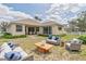 Outdoor backyard featuring patio furniture and an open lawn, great for outdoor entertaining at 12642 Cara Cara Loop, Bradenton, FL 34212