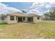 Backyard featuring a large, open lawn, perfect for activities and outdoor gatherings at 12642 Cara Cara Loop, Bradenton, FL 34212