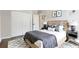 Cozy bedroom with a modern headboard, a comfy bed, and stylish bedside tables at 12642 Cara Cara Loop, Bradenton, FL 34212