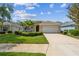 Charming single-story home with a well-manicured lawn and a two-car garage, set in a friendly neighborhood at 12642 Cara Cara Loop, Bradenton, FL 34212