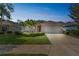 Charming home featuring manicured lawn and a two-car garage, ideal for comfortable living and curb appeal at 12642 Cara Cara Loop, Bradenton, FL 34212