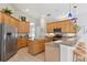 Open kitchen with stainless appliances, central island, breakfast bar, and ample cabinet space at 12642 Cara Cara Loop, Bradenton, FL 34212