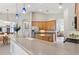 Spacious kitchen with wood cabinets, an island, and stainless steel appliances at 12642 Cara Cara Loop, Bradenton, FL 34212