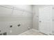 Practical laundry room featuring shelving for storage, tile floors, and a utility sink hookup at 12642 Cara Cara Loop, Bradenton, FL 34212