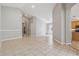Spacious living area showcasing tile floors, neutral paint, and access to other areas of the home at 12642 Cara Cara Loop, Bradenton, FL 34212
