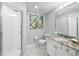 Bathroom featuring a glass enclosed shower, granite countertop vanity, and neutral walls at 1280 Dolphin Bay Way # 204, Sarasota, FL 34242