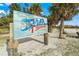 Siesta Key Beach sign surrounded by palm trees marking America's #1 beach destination at 1280 Dolphin Bay Way # 204, Sarasota, FL 34242
