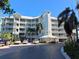 Beautiful condominium complex with well-maintained landscaping, covered parking, and easy access to amenities at 1280 Dolphin Bay Way # 204, Sarasota, FL 34242
