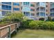 Beautiful condo building with lush landscaping, waterfront views and community dock access at 1280 Dolphin Bay Way # 204, Sarasota, FL 34242