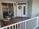 Charming entryway featuring a white door, decorative wreath, and seating area at 1280 Dolphin Bay Way # 204, Sarasota, FL 34242