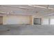Indoor garage with multiple spots and overhead pipes at 1280 Dolphin Bay Way # 204, Sarasota, FL 34242