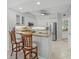 Modern kitchen with stainless steel appliances, breakfast bar, and ample cabinet space at 1280 Dolphin Bay Way # 204, Sarasota, FL 34242