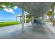 Outdoor pavilion with concrete columns and roof offering shade and seating areas, near the beach at 1280 Dolphin Bay Way # 204, Sarasota, FL 34242