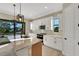 Stylish kitchen featuring a large island, modern appliances, recessed lighting, and light cabinetry at 144 Spring Dr, Rotonda West, FL 33947