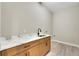 Laundry room features new cabinetry with a solid surface countertop, undermount sink and modern faucet at 144 Spring Dr, Rotonda West, FL 33947