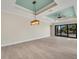 Open-concept living area featuring tile floors, recessed lights, and sliding glass doors to the lanai at 144 Spring Dr, Rotonda West, FL 33947