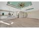 Open concept living space featuring recessed lights, modern kitchen, and tile flooring at 144 Spring Dr, Rotonda West, FL 33947