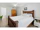 Bright bedroom with wood-look flooring, ceiling fan, and natural light at 157 Pinehurst Dr # 157, Bradenton, FL 34210