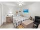 Bedroom offers wood-look floors, ceiling fan, and calming decor for a peaceful retreat at 157 Pinehurst Dr # 157, Bradenton, FL 34210