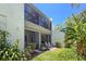 Two-story condo exterior showcasing an attached patio and yard that offers outdoor enjoyment and curb appeal at 157 Pinehurst Dr # 157, Bradenton, FL 34210