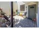 Outdoor brick-paved patio with chairs and potted plants, providing a cozy outdoor space at 157 Pinehurst Dr # 157, Bradenton, FL 34210