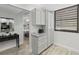 Hallway area featuring built-in cabinets and drawers leading to a bedroom at 157 Pinehurst Dr # 157, Bradenton, FL 34210