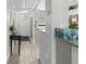 Bright hallway featuring modern decor and wood-look tile flooring at 157 Pinehurst Dr # 157, Bradenton, FL 34210