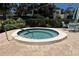 View of a hot tub on brick patio, complete with nearby seating, enhancing the recreational area's appeal at 157 Pinehurst Dr # 157, Bradenton, FL 34210