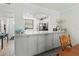 Kitchen pass-through featuring granite countertops and stylish gray cabinets at 157 Pinehurst Dr # 157, Bradenton, FL 34210