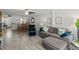 Comfortable living room with tile flooring, ceiling fan, and a view of the dining area at 157 Pinehurst Dr # 157, Bradenton, FL 34210