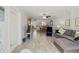 Spacious living area with wood-look flooring, comfortable seating, and open floor plan at 157 Pinehurst Dr # 157, Bradenton, FL 34210