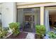 View of a screened patio, complete with plants and outdoor access to a condo with great views at 157 Pinehurst Dr # 157, Bradenton, FL 34210