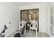 Enclosed lanai space features two seating areas and serene views of the tropical landscaping surrounding the property at 157 Pinehurst Dr # 157, Bradenton, FL 34210