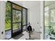 Enclosed lanai features a view of lush landscaping and tropical foliage, offering a relaxing and private outdoor space at 157 Pinehurst Dr # 157, Bradenton, FL 34210